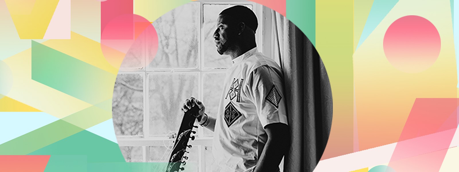 Seckou Keita stands on a pink and yellow background with his kora