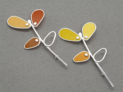 Metal leaf pins in brown and yellow