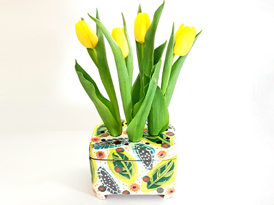 A colourful leaf pattern on a flower holder