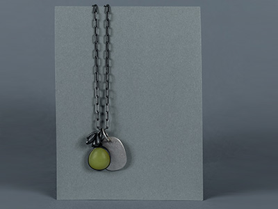 Silver necklace with silver pendant and green pendant