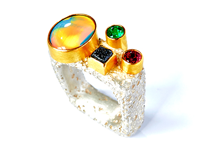 Ornate ring with multicoloured stones
