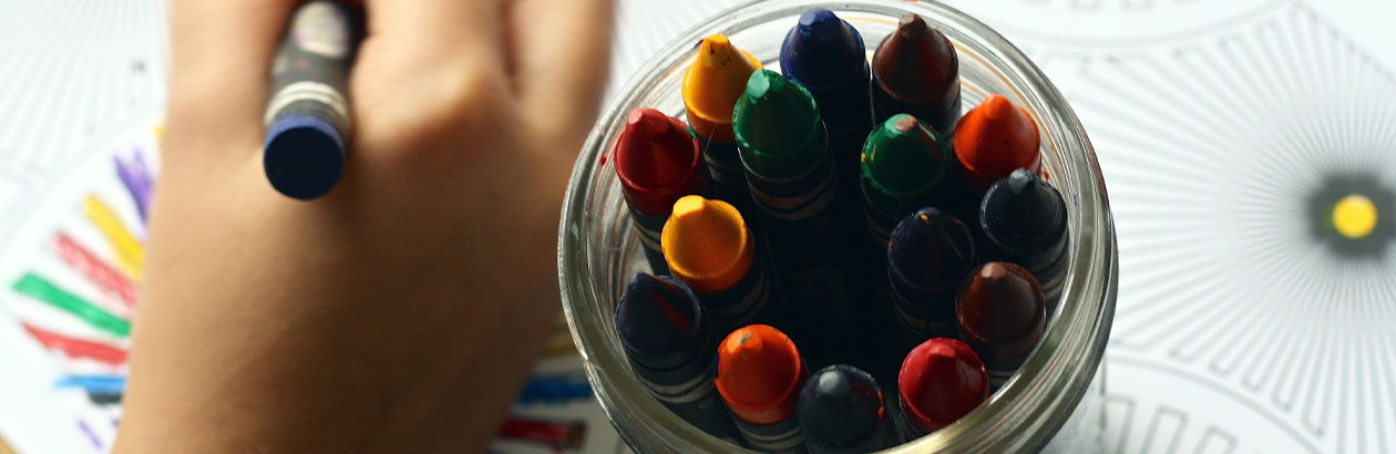 Pens and pencils spread across a desk