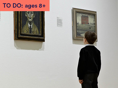 Boy in gallery looks at artwork on wall. Art is by Lowry. Boy looks straight ahead at a painting of a man's face. Keyword in corner: TO DO: ages 8+