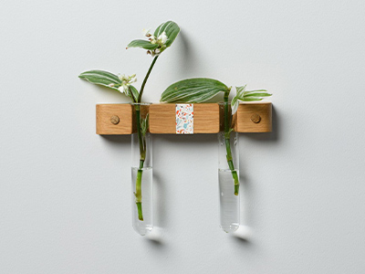 Wooden plant hanger with confetti pattern in the centre