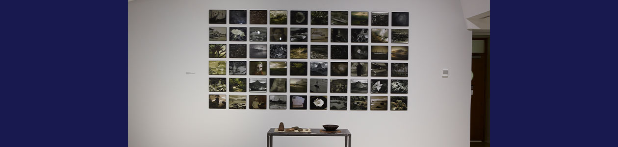 Photos arranged in a grid on the wall