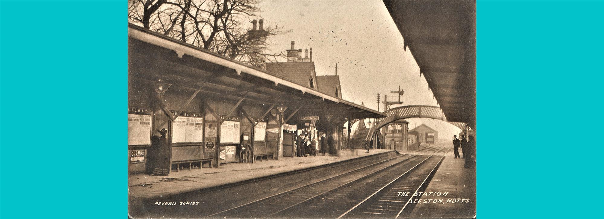 Photograph on postcard of beeston station. Platform at beeston in black and white