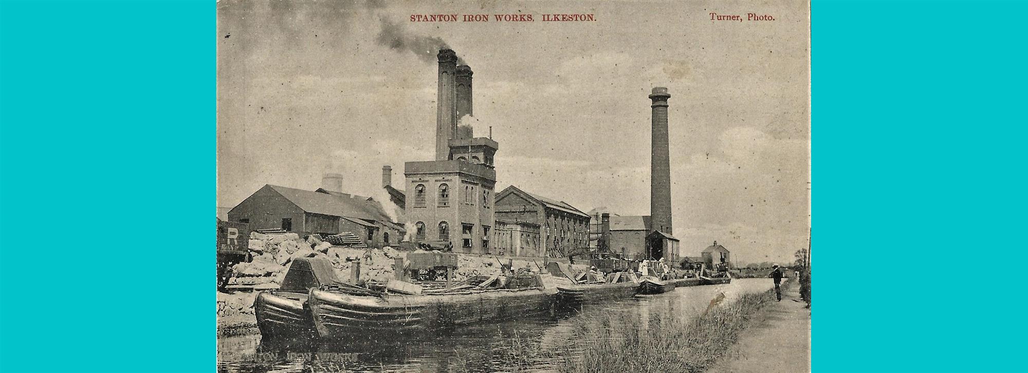 Photograph on postcard of stanton iron works. Image of factory in black and white