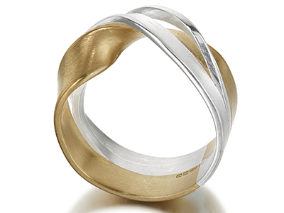 A silver and gold twisted ring