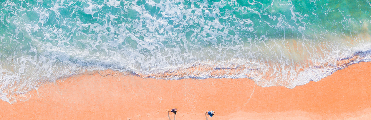 blue green ocean on white sands