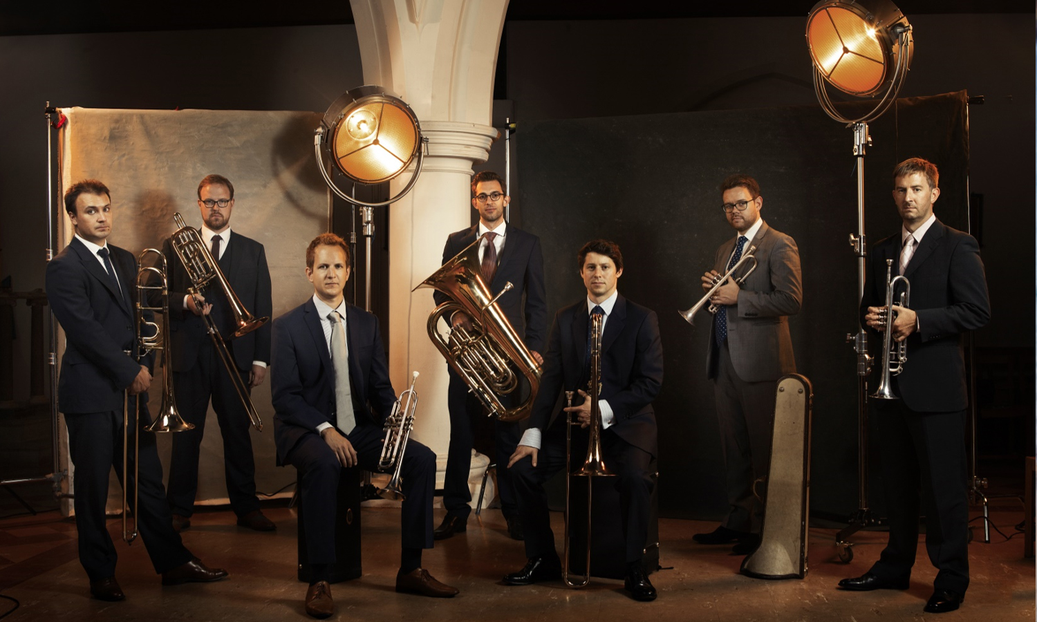 A group photo of the members of the Septura ensemble with their instruments
