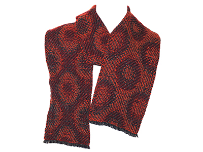 A red, patterned, handwoven scarf
