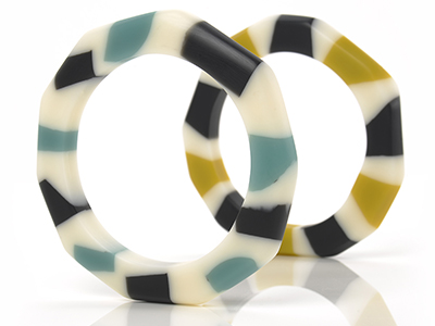 Resin white, teal, black, and mustard rings