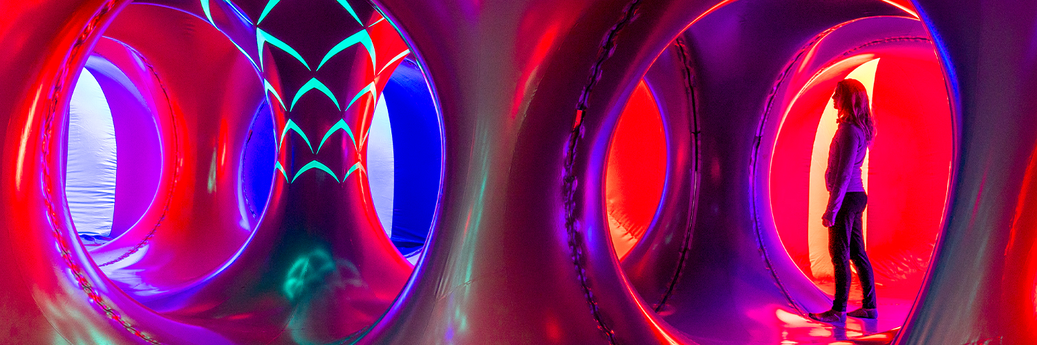 Inside the luminarium with bright purple and red colours 