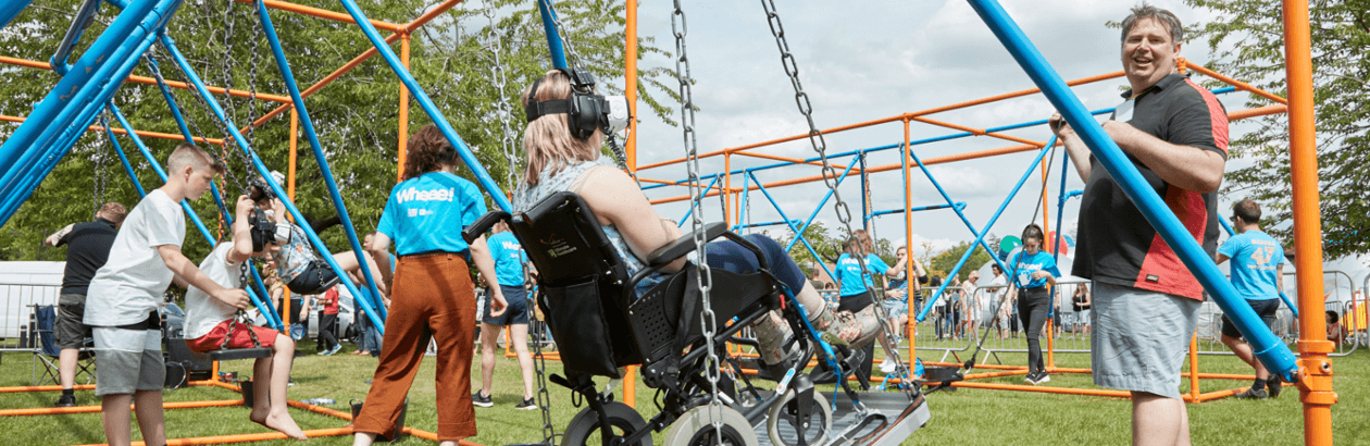 Audience member in a wheelchair enjoying Wheee! Festival