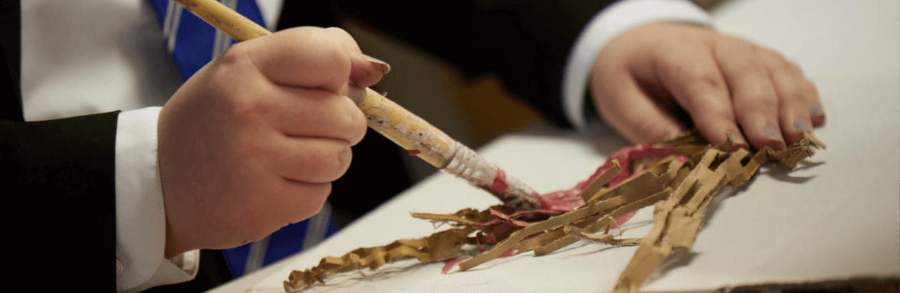 Young person creating artwork in workshop